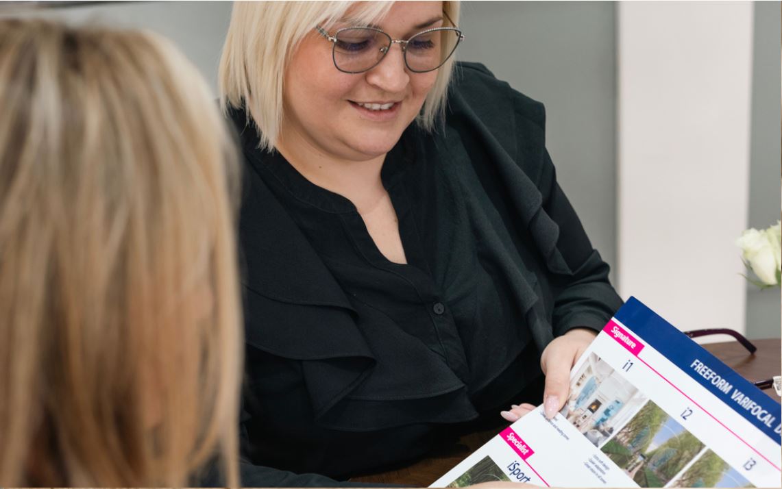 lenses page header - staff helping customer